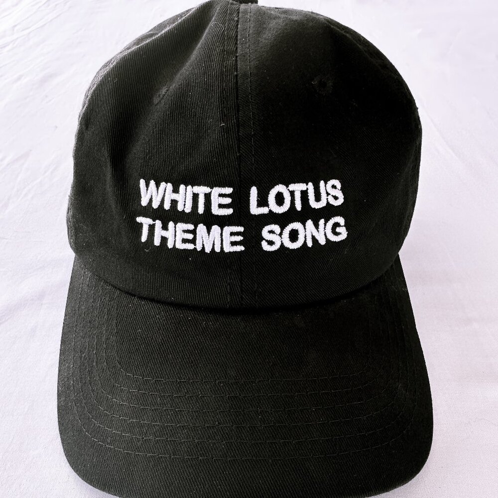Intentionally Blank White Lotus Theme Song Slogan Hat SOLD OUT